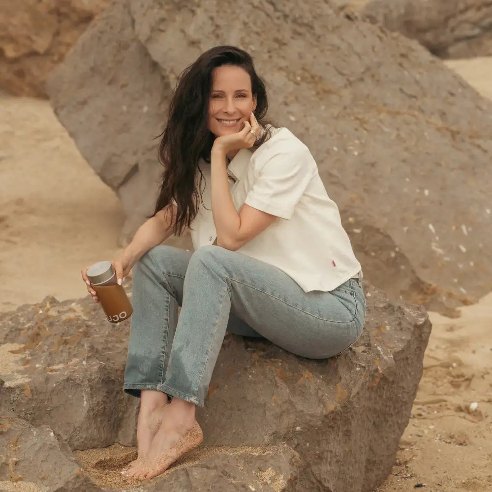 Brown insulated travel mug with silver lid and ’s’go’ branding