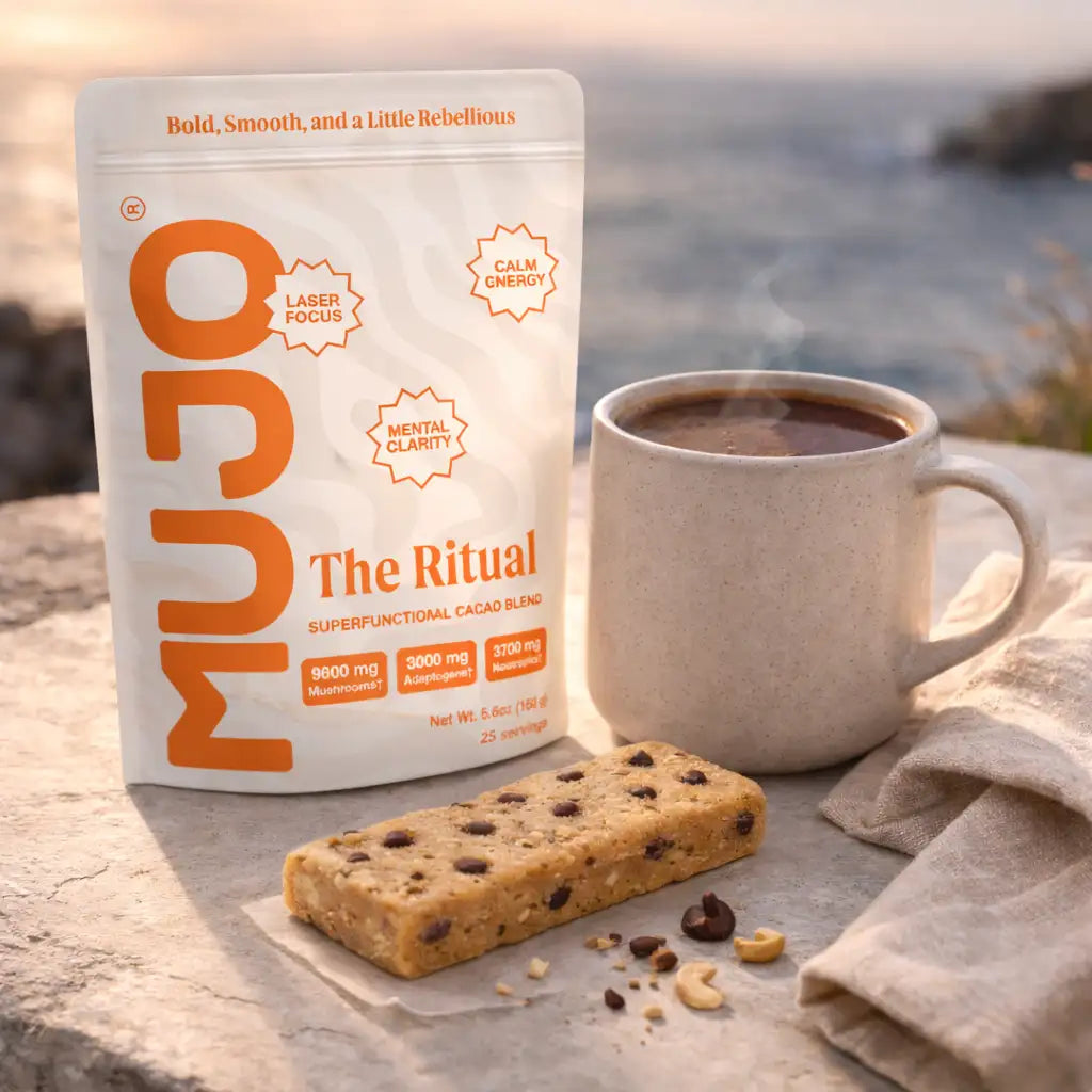A white and orange pouch of mujo the ritual superfunctional cacao blend with bold, smooth branding.